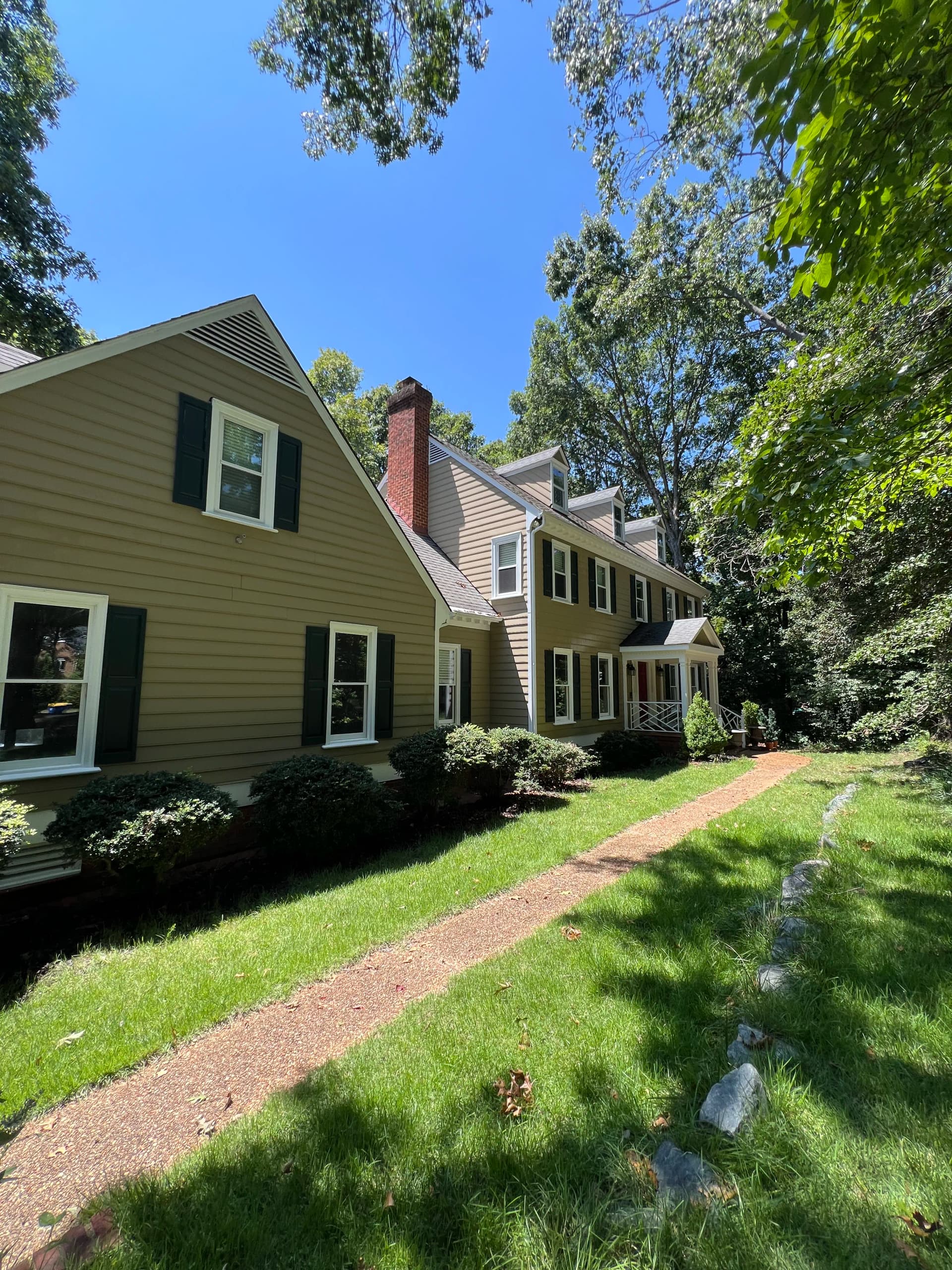 Gutter Cleanout and House Wash on a Wooded Property image